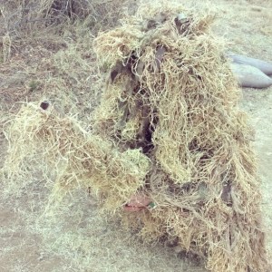 Crouching hay-bale, hidden sniper